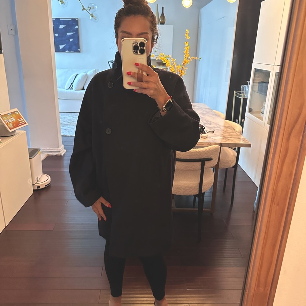 Mango navy color medium size wool coat. The length hits at thigh.